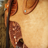 Half Breed Vaquero Wade Saddle by Keith Valley Specs: Wade tree by Rick Reed 15 & 1/2 inch seat, Gullet - 7 & 1/2H X 6 & 1/4W X 4, 93 Degree Bars, Horn - 3 & 5/8ths high X 4 & 1/2 Guatelajara, Cantle - 4&1/2 inches high X 12&1/2 inches wide, Cheyenne Roll - 1 & 3/4 inches, 7/8ths flat plate riggin. Sporting Keith's Vaquero Border with Sheridan Floral tooling within, Stainless Steel Hardware - by Harwood, 4 inch Monel Stirrups, Santa Barbara twisted for easy handling, Vaquero outside stirrup leathers, 100% handmade Mohair Roper Cinch, Hand cut 7 foot latigos for both sides. Made for a special order - **SOLD** but we take orders.